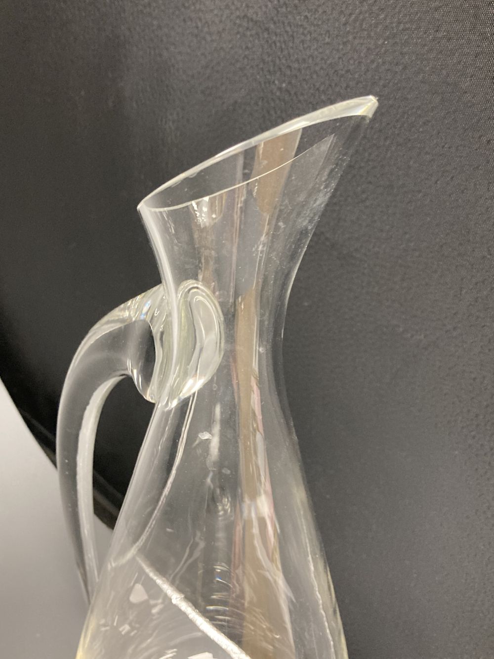 A contemporary Reidel glass jug, signed, height 39cm